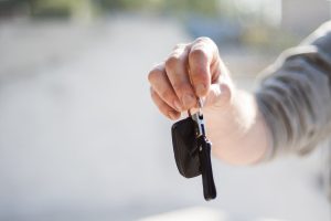 Person holding car keys near Fishers, IN