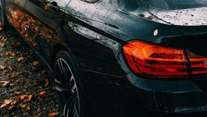 Car driving in fall near Fishers, IN