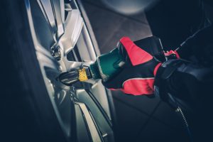 A mechanic performing a tire rotation near Fishers, Indiana.