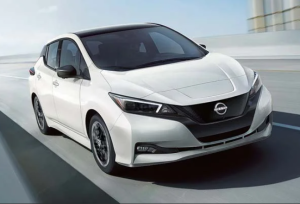 A 2024 Nissan LEAF driving down a highway near Fishers, Indiana.