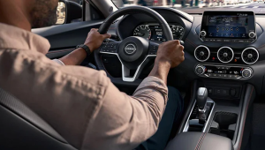 A person driving a 2024 Nissan Sentra, enjoying its suite of advanced driver assistance features near Fishers, Indiana