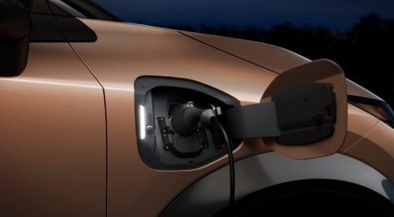 Close-up image of charging cable plugged in | Ed Martin Nissan of Fishers in Fishers IN